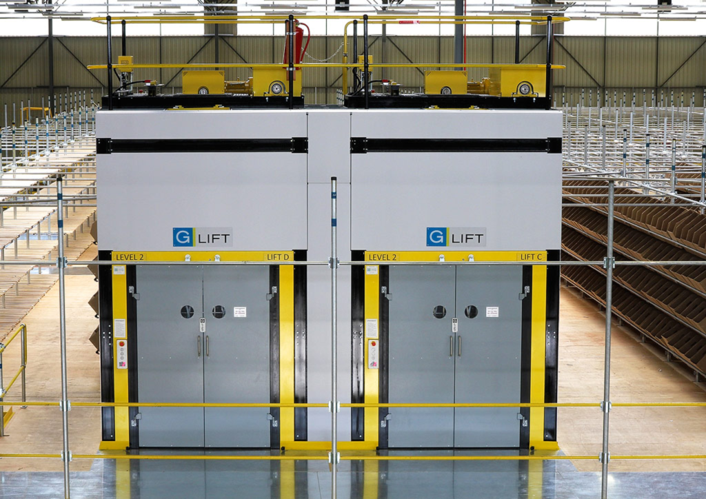 Twin lifts with drive units above